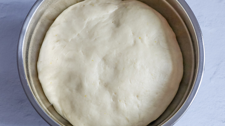 risen dough in bowl