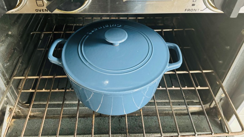 blue lidded pot in oven