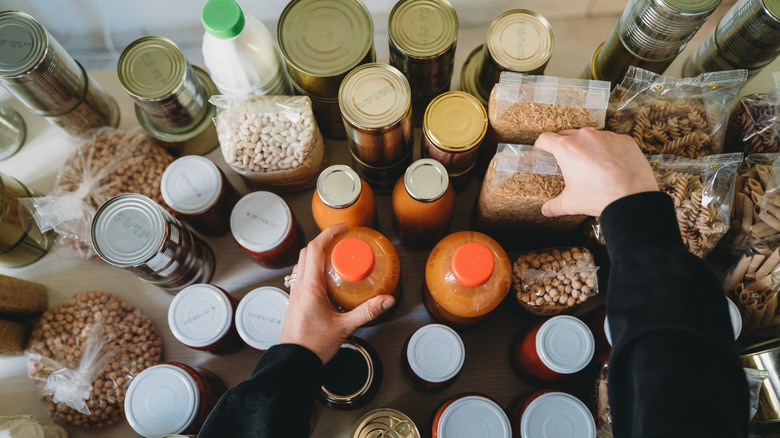 hands arranging pantry items