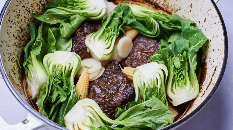 bok choy and beef in pot