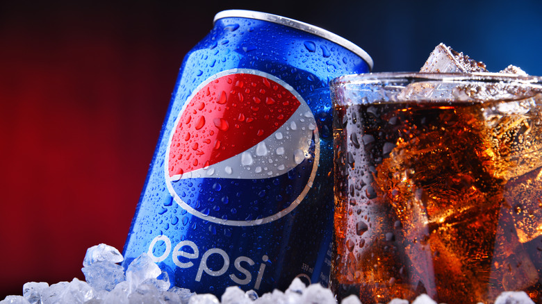 pepsi can and drink glass