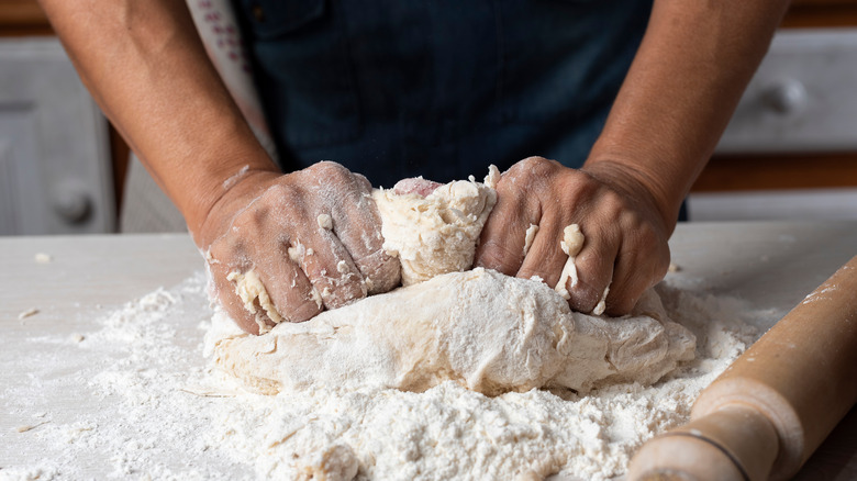 Hands kneading dough