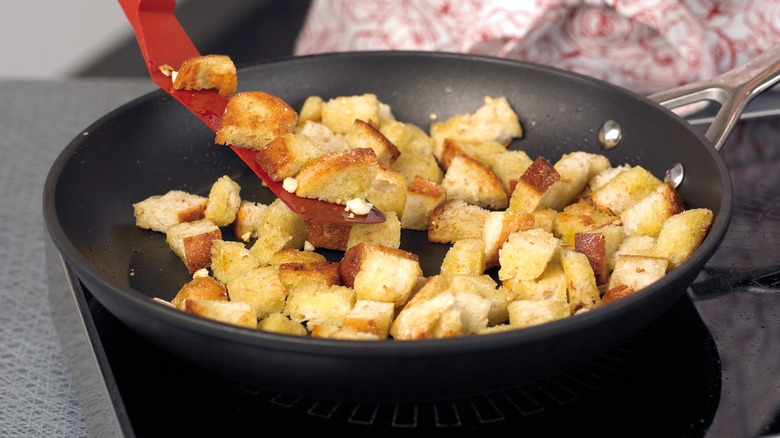 Making croutons in a skillet