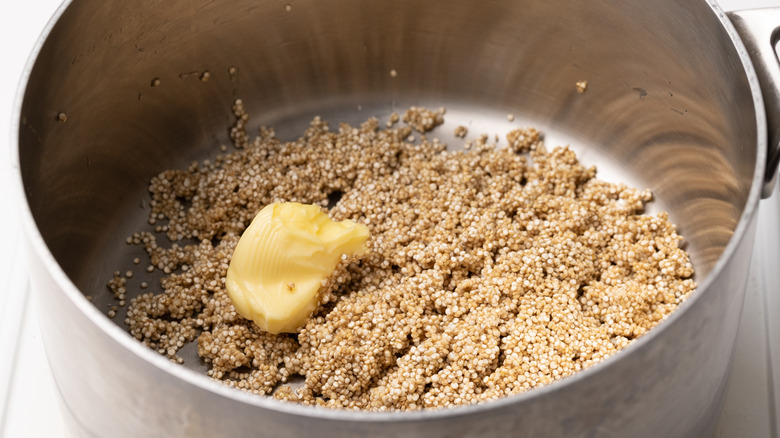 quinoa and butter in saucepan