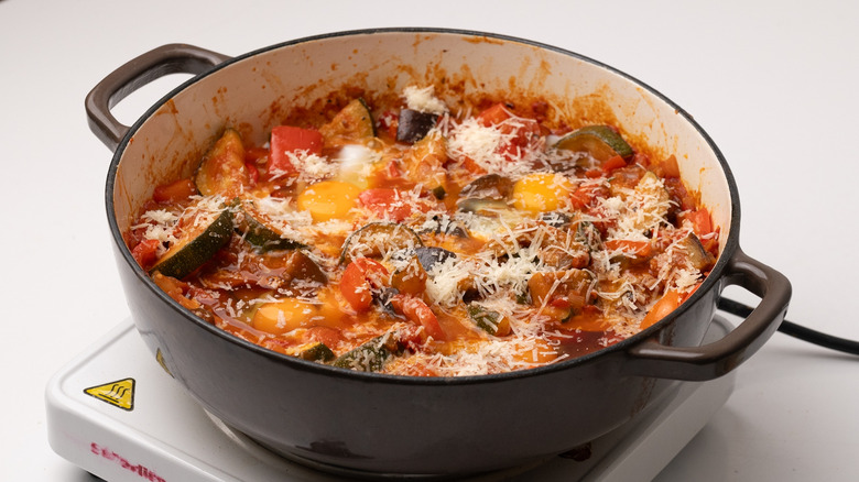 topping ratatouille with Parmesan