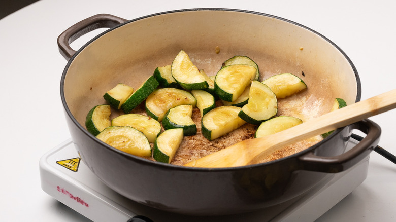 frying zucchini in a pan