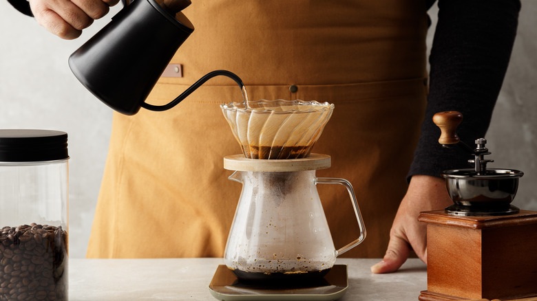 Pouring hot water in coffeee