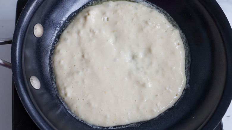 pancake batter in pan