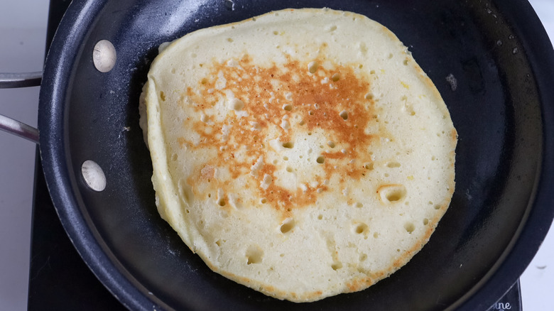 golden pancake in pan