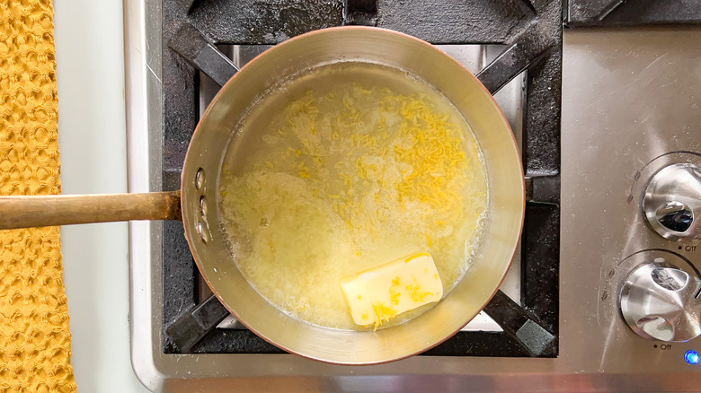 Lemon juice, butter, salt, and lemon zest in saucepan on stovetop