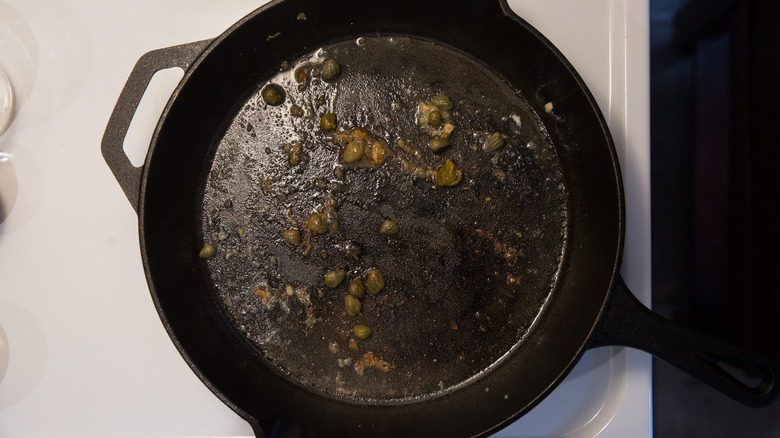 piccata sauce in iron pan