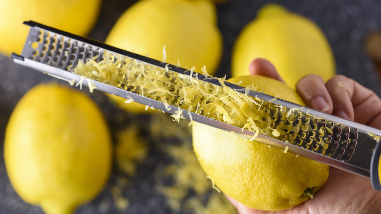 hand zesting lemon