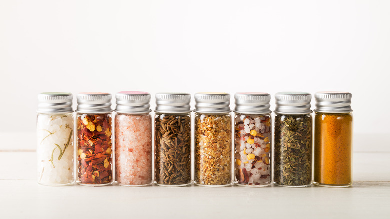 Various spices in glass containers