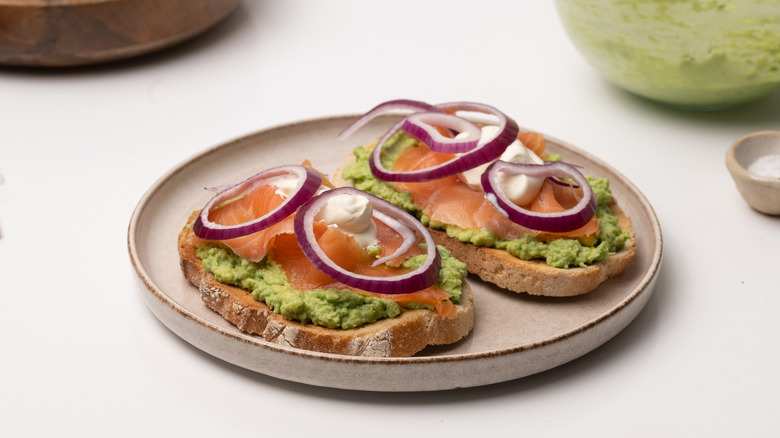 assembling smoked salmon avocado toast