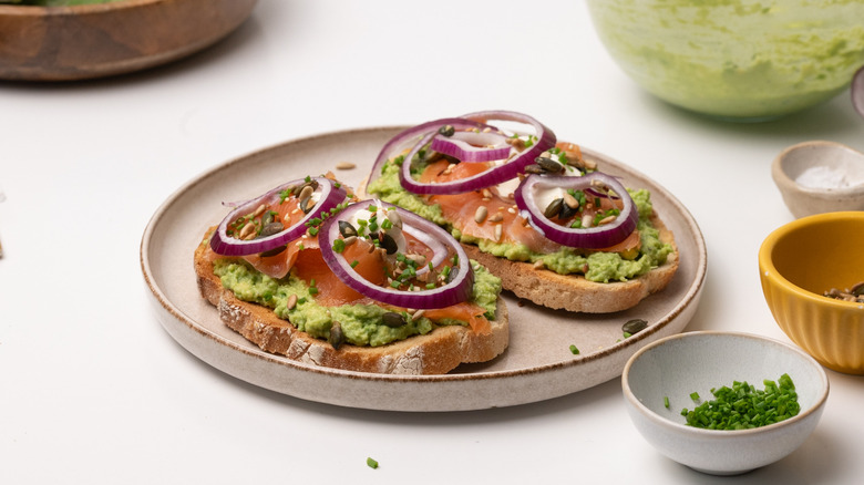 assembling smoked salmon avocado toast