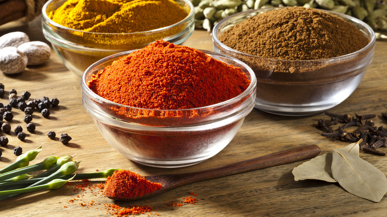 Cinnamon and spices in glass bowls