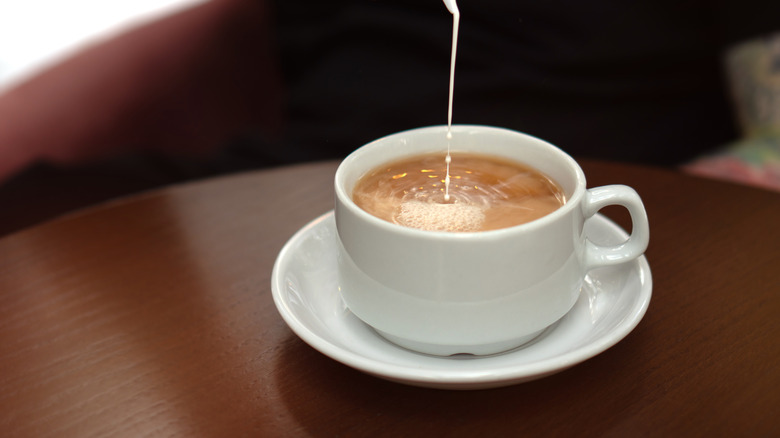 cream poured into milk tea