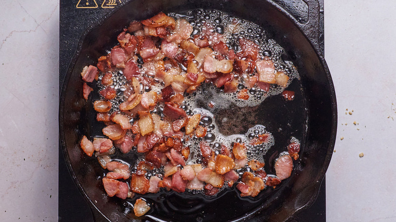 cooking bacon in a skillet