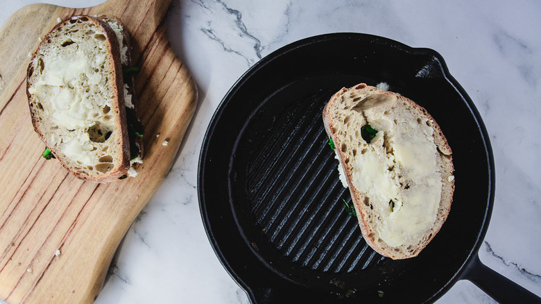 Grilled cheese in pan and besides it