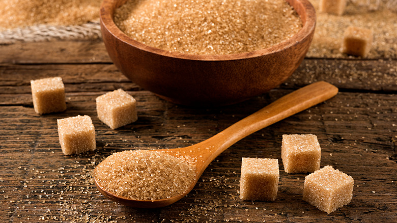 brown sugar in a bowl and in cubes on a table