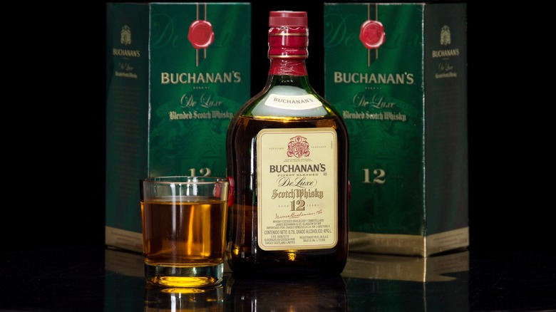 Buchanan's whisky bottle with glass