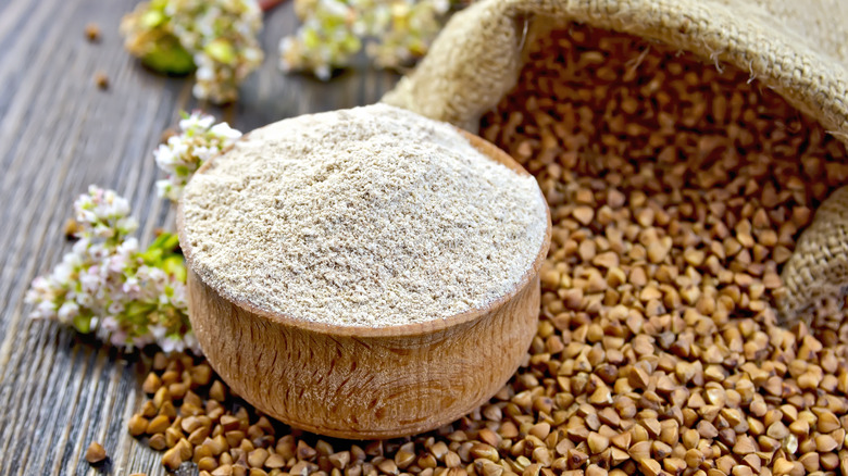 Buckwheat flour in wooden bowl