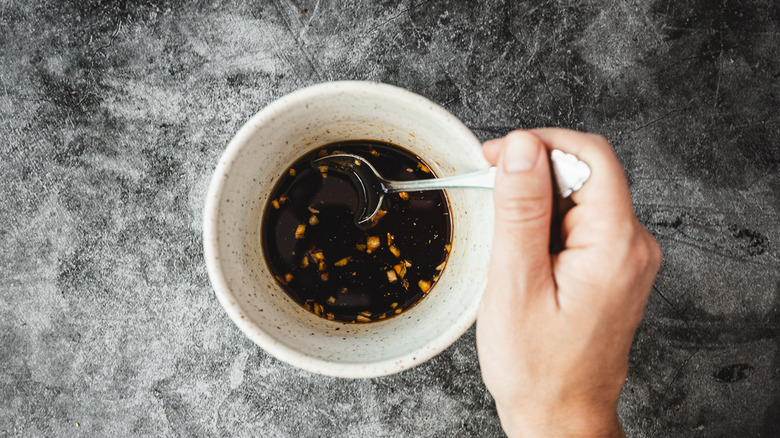 mixing sauce in bowl