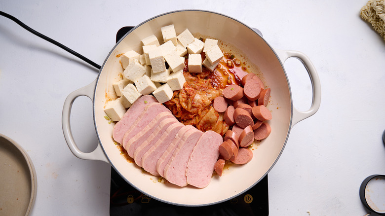 spam and hot dog in pot