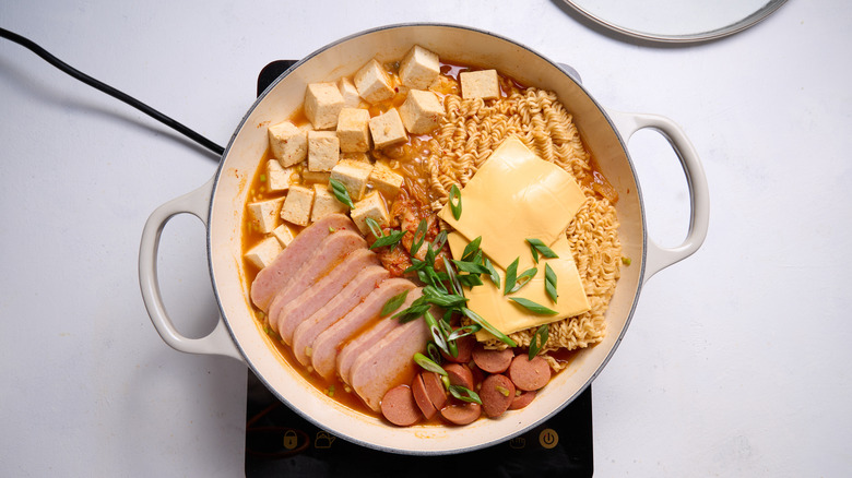 pot of budae jjigae with cheese