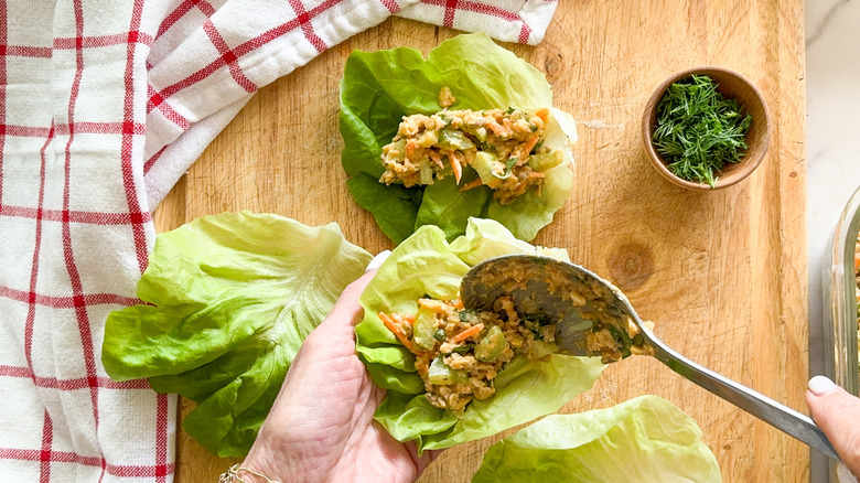 scooping garbanzo mixture into lettuce