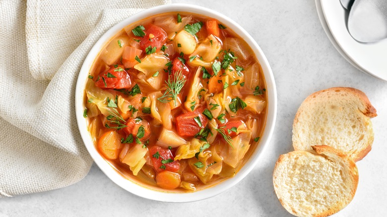 Cabbage soup and bread slices