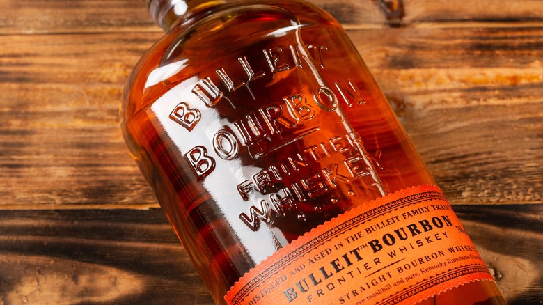 Bulleit bourbon on wooden background