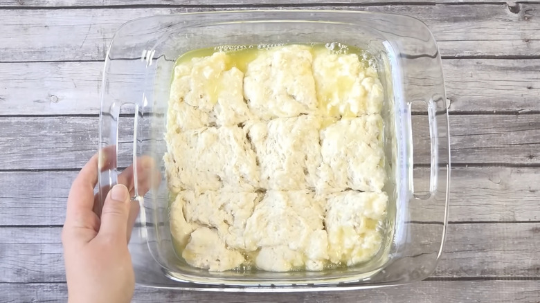 butter dip biscuits dough in glass pan