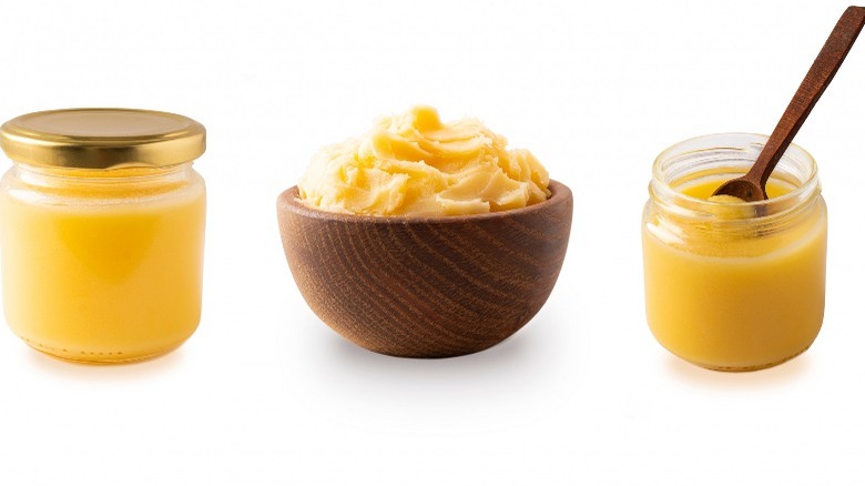 Ghee in a closed jar, in a wooden bowl, and in an open jar with wooden spoon