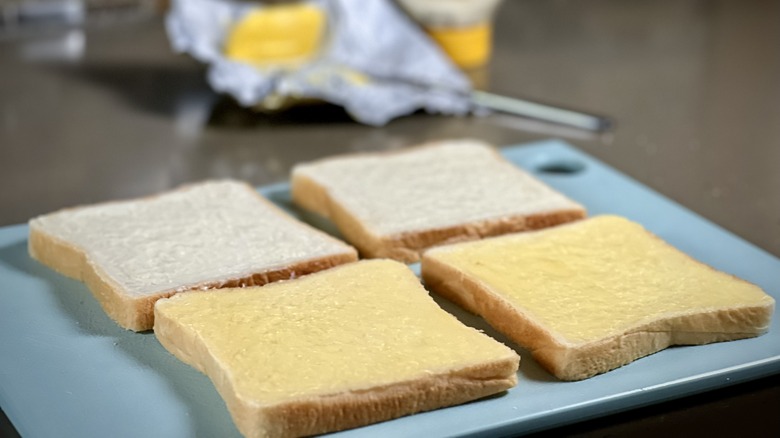 Bread coated with butter and mayonnaise