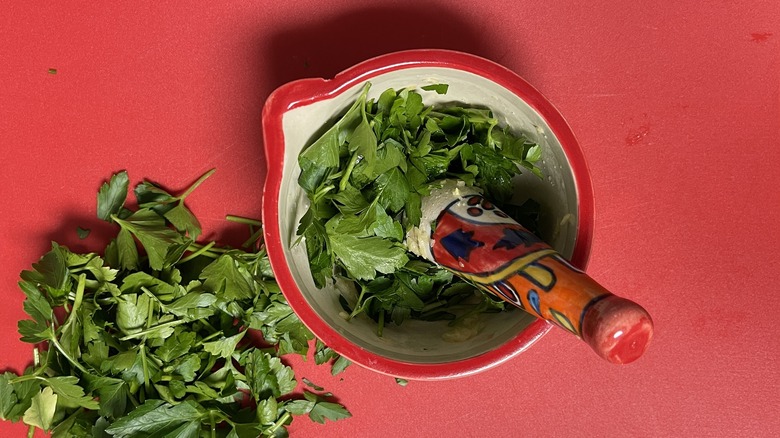 parsley in mortar with pestle