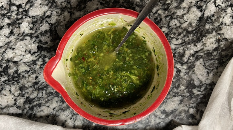 parsley and oil in mortar