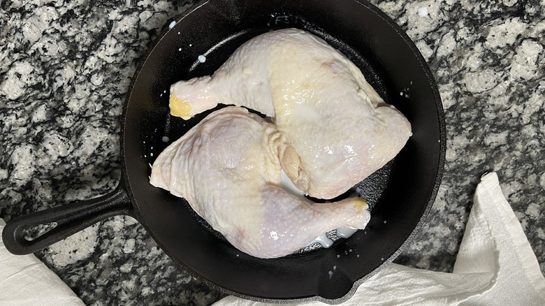 raw chicken in pan