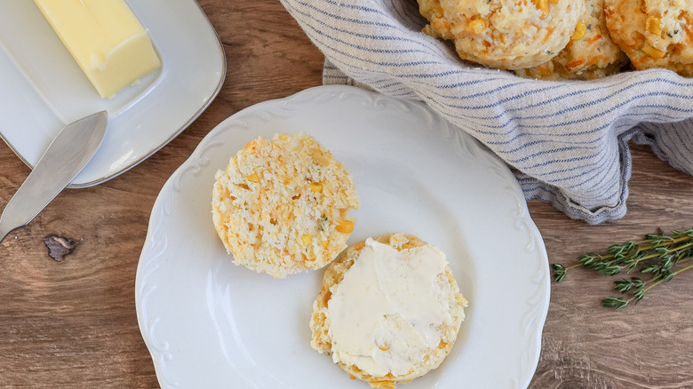 halved biscuit with butter