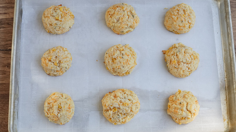 corn biscuits on baking sheet
