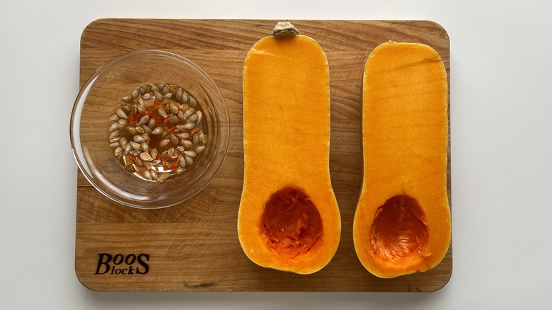 butternut squash halves on board