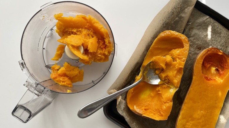 butternut squash halves in pan