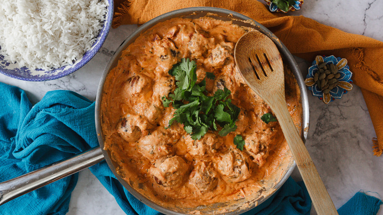 Kofta in pan with rice and cilantro