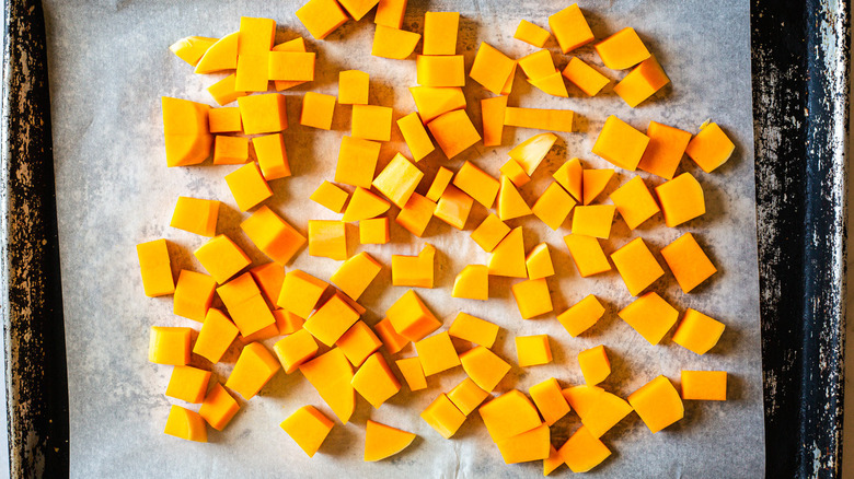 cubed squash on baking sheet