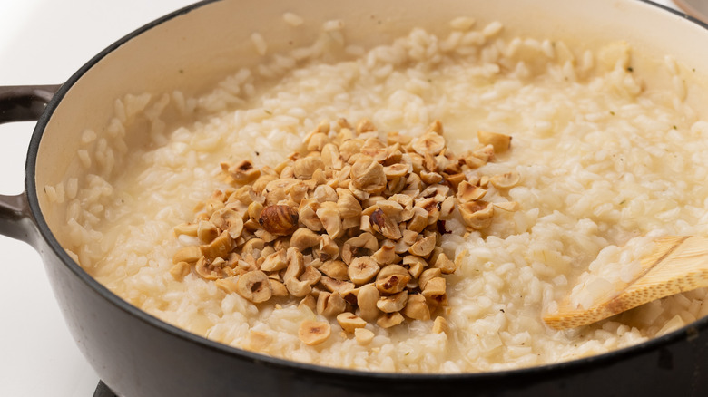 Adding chopped hazelnuts to risotto