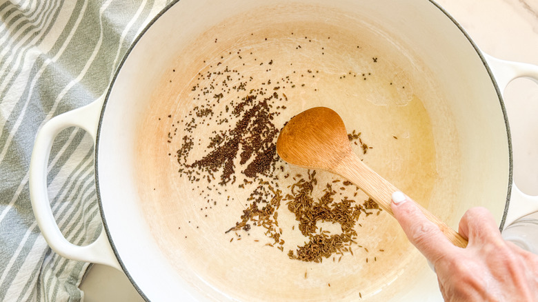 hand stirring seeds