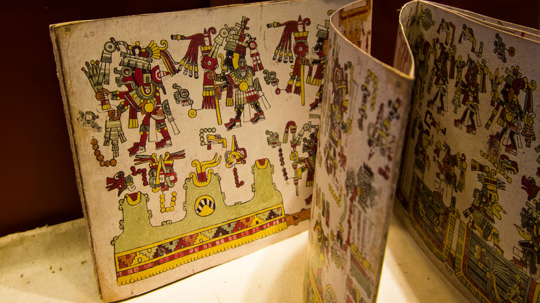 Mayan artwork showing cacao drinker