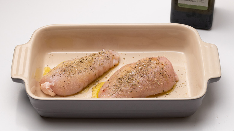 seasoned chicken in baking dish