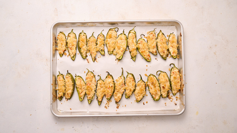 jalapeno poppers on baking sheet