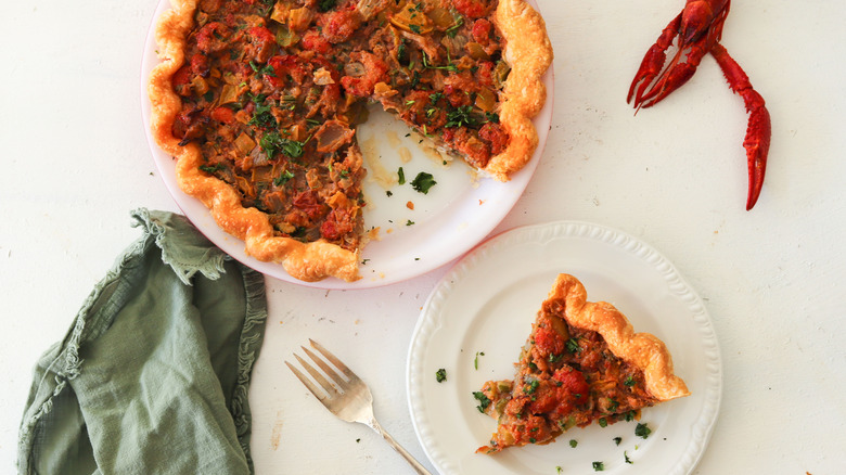 whole crawfish pie with slice